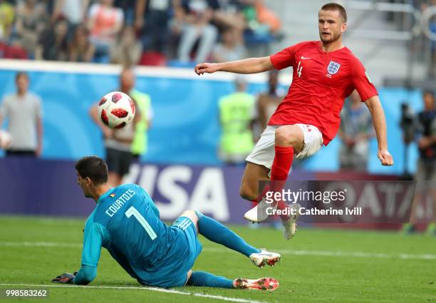 Eric Dier of England chips the ball over goalkeeper Thibaut Courtois of Belgium before but effort is cleared of the line by Toby Alderweireld during...