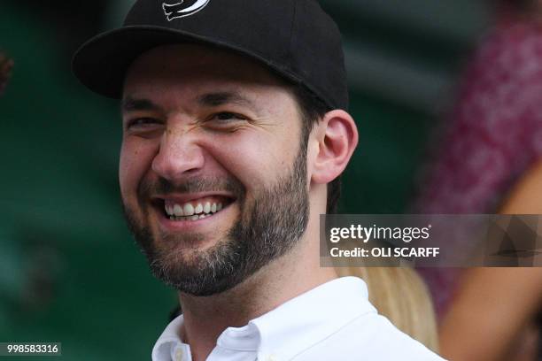 Husband of US player Serena Williams, Alexis Ohanian, takes his seat on court to watch her play against Germany's Angelique Kerber in their women's...