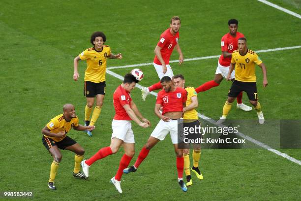 Harry Maguire of England competes for a header with Ruben Loftus-Cheek of England and Thomas Vermaelen of Belgium during the 2018 FIFA World Cup...