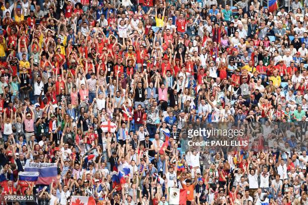 Fans cheer during their Russia 2018 World Cup play-off for third place football match between Belgium and England at the Saint Petersburg Stadium in...