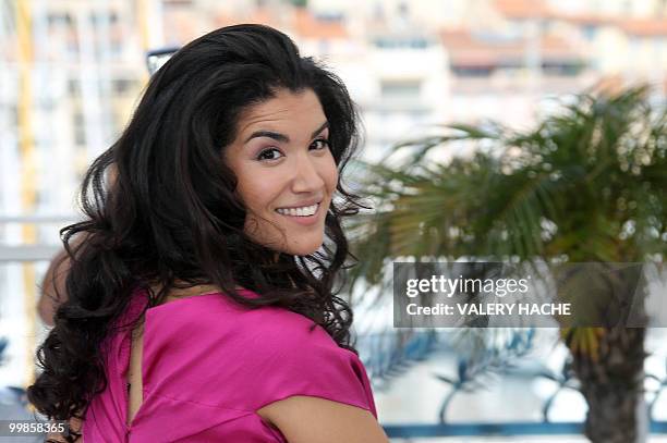 French actress Sabrina Ouazani poses during the photocall of "Des Hommes et des Dieux" presented in competition at the 63rd Cannes Film Festival on...