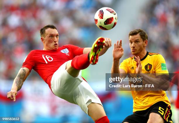 Phil Jones of England clears the ball under pressure from Jan Vertonghen of Belgium during the 2018 FIFA World Cup Russia 3rd Place Playoff match...