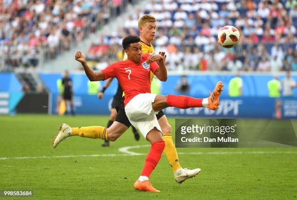 Jesse Lingard of England controls the ball ahead of Kevin De Bruyne of Belgium during the 2018 FIFA World Cup Russia 3rd Place Playoff match between...