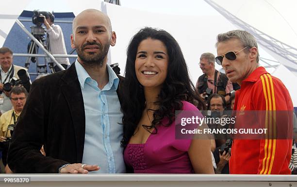 French actor Farid Larbi , French actress Sabrina Ouazani and French actor Lambert Wilson during the photocall of "Des Hommes et des Dieux" presented...