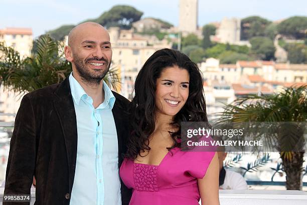 French actor Farid Larbi and French actress Sabrina Ouazani pose during the photocall of "Des Hommes et des Dieux" presented in competition at the...