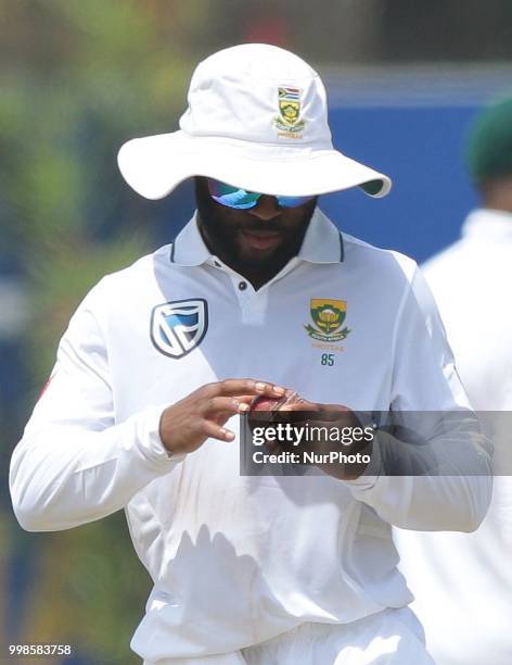 South African cricketer Temba Bavuma polishes the ball during the 3rd day's play in the first Test cricket match between Sri Lanka and South Africa...