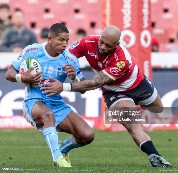 Manie Libbok of the Bulls and Lionel Mapoe of the Lions during the Super Rugby match between Emirates Lions and Vodacom Bulls at Emirates Airline...