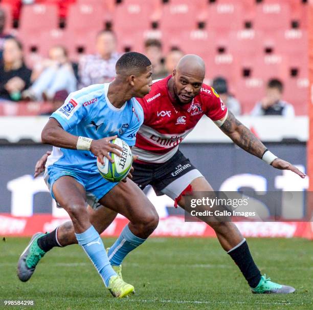 Manie Libbok of the Bulls and Lionel Mapoe of the Lions during the Super Rugby match between Emirates Lions and Vodacom Bulls at Emirates Airline...