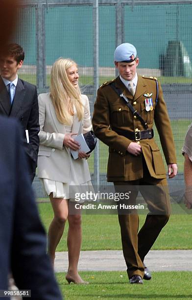 Prince Harry walks with girlfriend Chelsy Davy following his pilot course graduation at the Army Aviation Centre on May 7, 2010 in Andover, England