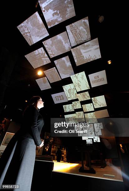 Woman admires a display explaining the 18th Century revolution in printing press design, in the new 'Galleries of Modern London' exhibition, at the...