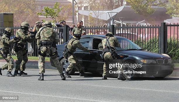 Sandton police carry out a car jacking drill in preperation for the 2010 World Cup on May 17, 2010 in Sandton, Johannesburg, South Africa. The Fifa...