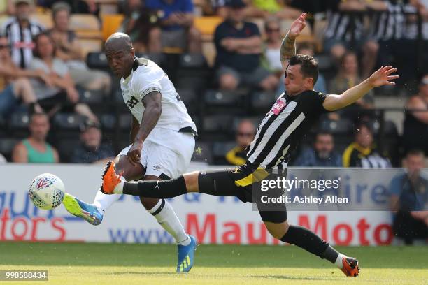 Jorge Grant of Notts County attempts to block a cross from Andre Wisdom of Derby County during a Pre-Season match between Notts County and Derby...