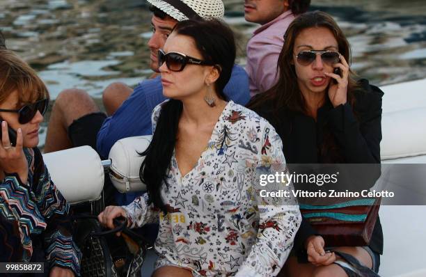 Actress Lindsay Lohan departs to attend Press Meeting aboard Lancia "Signora Del Vento" on May 17, 2010 in Cannes, France.