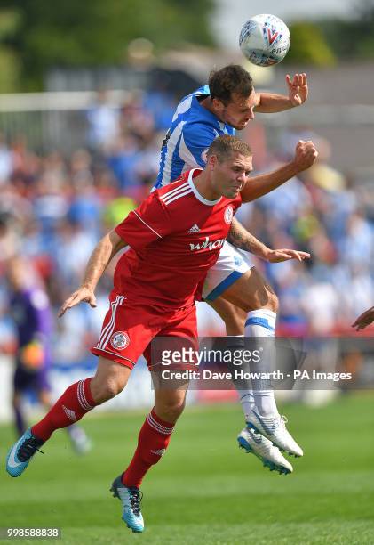 Huddersfield Town's Jon Gorenc Stankovic battles with Accrington Stanley's Billy See during the pre-season match at The Wham Stadium, Accrington.