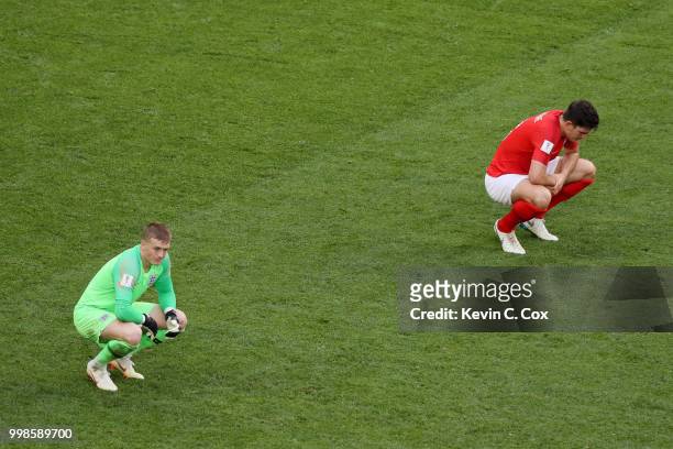 Jordan Pickford of England and team mate Harry Maguire show their dejection following Belgium's second goal during the 2018 FIFA World Cup Russia 3rd...
