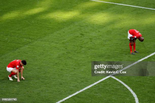 Harry Maguire and Fabian Delph of England look dejeceted after their side concede during the 2018 FIFA World Cup Russia 3rd Place Playoff match...