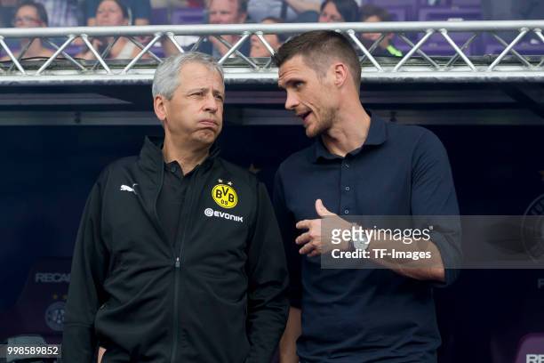 Head coach Lucien Favre of Borussia Dortmund speak with , Sebastian Kehl of Borussia Dortmund during the friendly match between Austria Wien and...