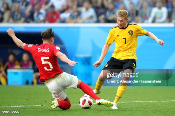 John Stones of England tackles Kevin De Bruyne of Belgium during the 2018 FIFA World Cup Russia 3rd Place Playoff match between Belgium and England...