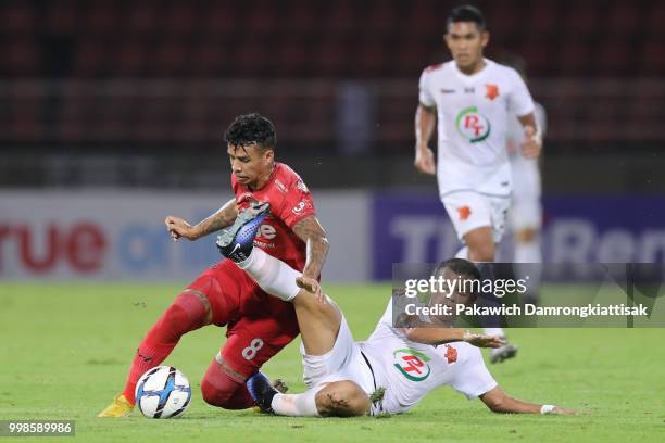 Vander Luis Silva Souza of True Bangkok United is tackled by unidentified PT Prachuap FC players during the Thai League 1 match between True Bangkok...