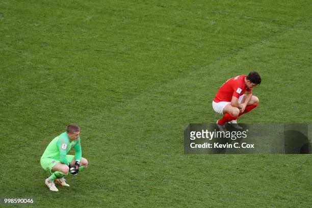 Jordan Pickford of England and team mate Harry Maguire show their dejection following Belgium's second goal during the 2018 FIFA World Cup Russia 3rd...