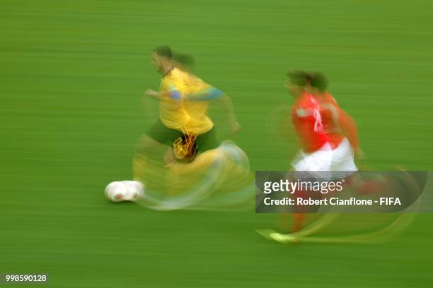 Eden Hazard of Belgium is chased by Dele Alli of England during the 2018 FIFA World Cup Russia 3rd Place Playoff match between Belgium and England at...