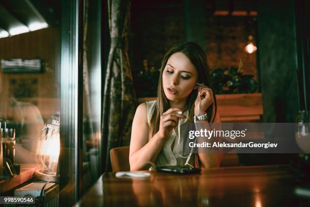 cute female preparing for video conference - mp3 juices stock pictures, royalty-free photos & images