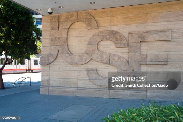 Logo for the University of California San Francisco medical center embedded into the wall of a building in the Mission Bay neighborhood of San...