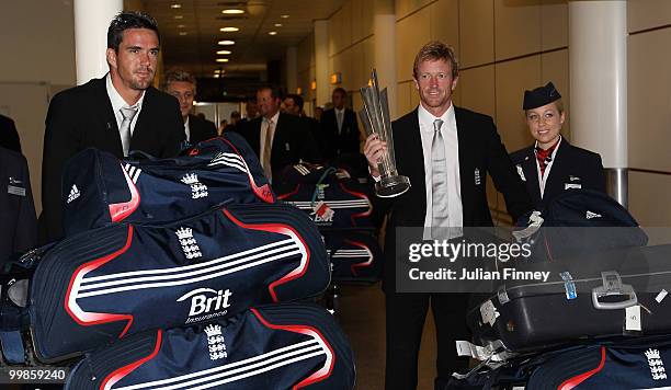 Kevin Pietersen and Captain, Paul Collingwood of England arrive with the World Twenty20 Cup Trophy as they return to Gatwick Airport on May 18, 2010...