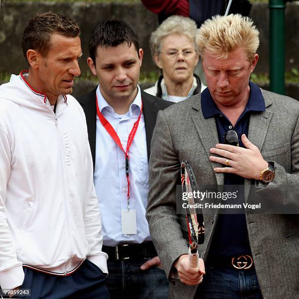 National coach Patrick Kuehnen of Germany and Boris Becker look on during day three of the ARAG World Team Cup at the Rochusclub on May 18, 2010 in...