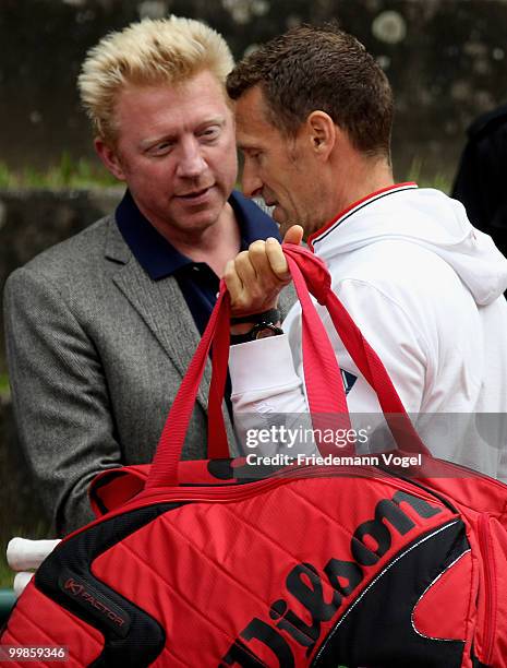 National coach Patrick Kuehnen of Germany and Boris Becker talk during day three of the ARAG World Team Cup at the Rochusclub on May 18, 2010 in...