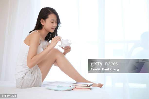 young woman in bedroom - young woman full body isolated stock pictures, royalty-free photos & images