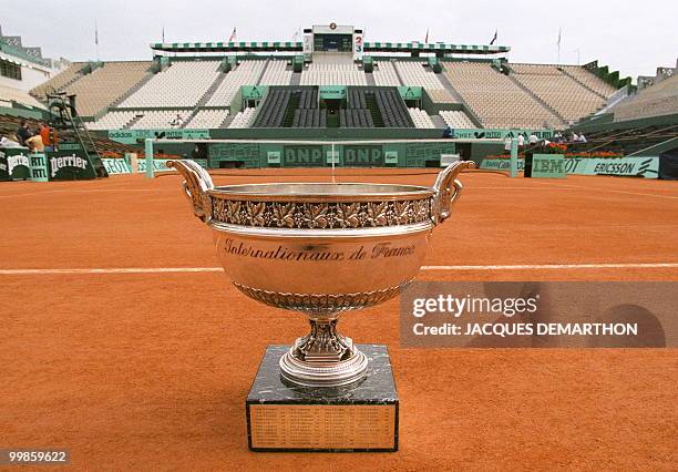 The trophy for the French Open men's singles competition is seen 06 June on Center Court at the Roland Garros stadium in Paris. The "Mousquetaires...