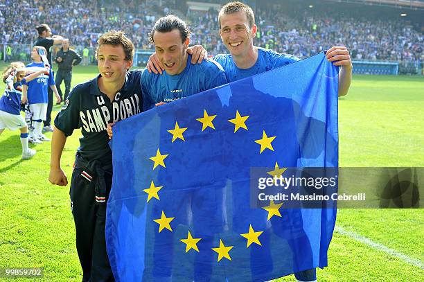 Ball boy, Daniele Mannini and Daniele Gastaldello of UC Sampdoria celebrate fourth place and the Champions League qualification after the Serie A...