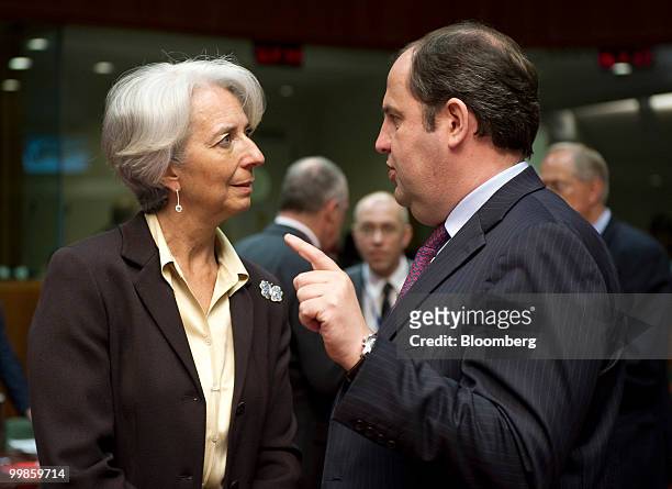 Christine Lagarde, France's finance minister, left, speaks with Josef Proell, Austria's finance minister, during the meeting of European Union...