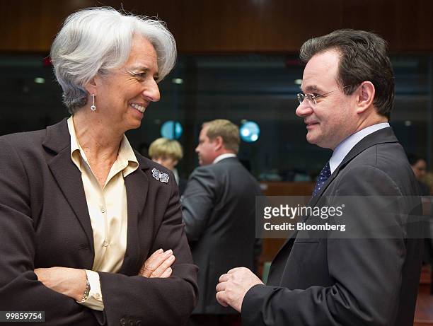 Christine Lagarde, France's finance minister, left, speaks with George Papaconstantinou, Greece's finance minister, during the meeting of European...