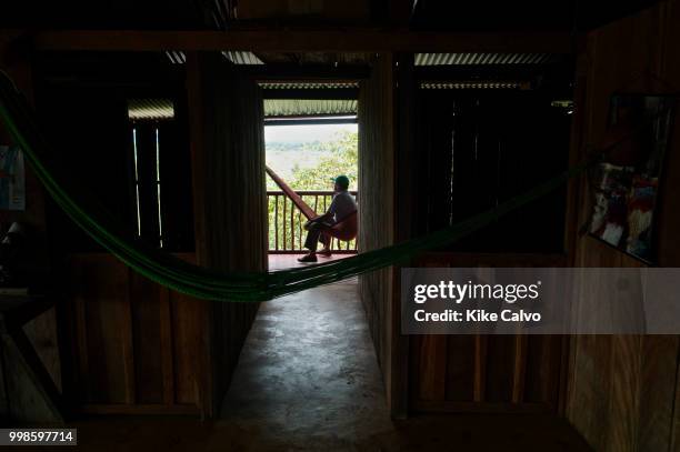 Elder resting in a traditional Colombian hammock during the hottest part of the day.