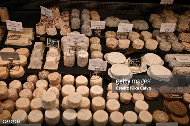 Wide variety of cheese for sell at a local supermarket.