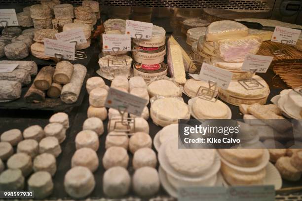 Wide variety of cheese for sell at a local supermarket.