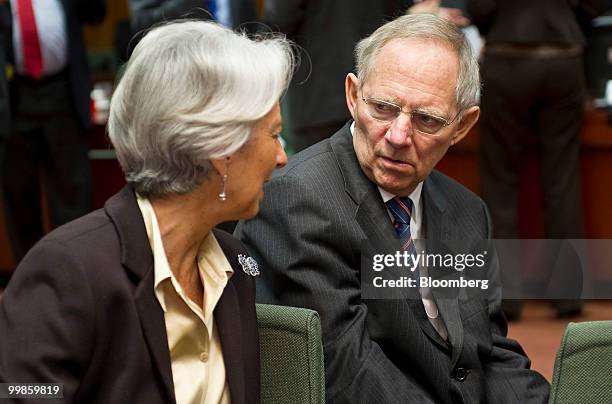 Christine Lagarde, France's finance minister, left, speaks with Wolfgang Schaeuble, Germany's finance minister, during the meeting of European Union...