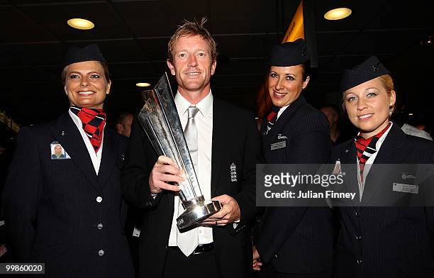 Captain, Paul Collingwood of England poses with the World Twenty20 Cup Trophy as he returns at Gatwick Airport on May 18, 2010 in London, England.