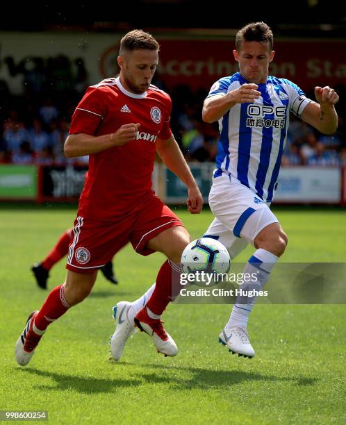 Jordan Clark of Accrington Stanley and Jonathan Hogg of Huddersfiled Town battle for the ball during the pre-season friendly between Accrington...