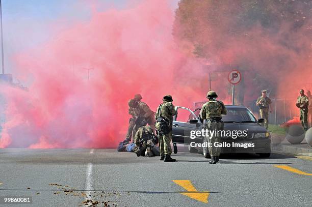 Sandton police demonstrate their skills in a car hijack situation, in preperation for the 2010 World Cup on May 17, 2010 in Sandton, Johannesburg,...