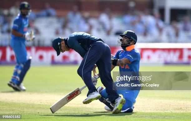India captain Virat Kohli collides with England captain Eoin Morgan during the 2nd ODI Royal London One-Day match between England and India at Lord's...