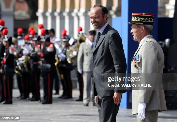 French Prime Minister Edouard Philippe is pictured in Nice on July 14 during a ceremony for the second anniversary of attacks on the French coastal...