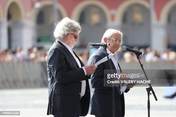 French actor Michel Boujenah and French actor Daniel Benoin delivers his speech in Nice on July 14 during a ceremony for the second anniversary of...