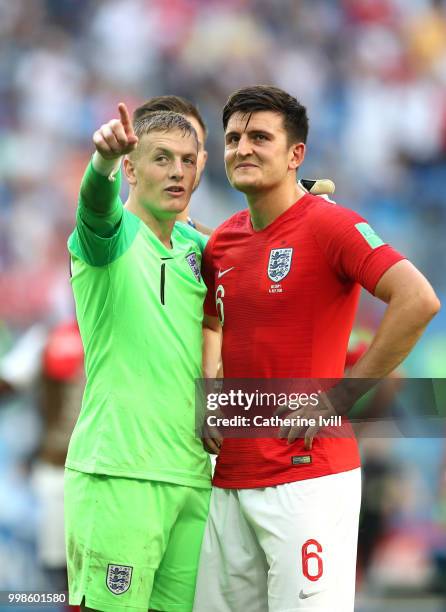 Jordan Pickford of England gestures as he speaks to Harry Maguire of England after the 2018 FIFA World Cup Russia 3rd Place Playoff match between...