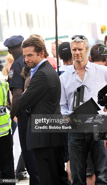 Actor Bradley Cooper and director Neil Burger on location for "Dark Fields" on April 8, 2010 in New York City.