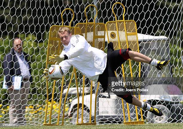 Manuel Neuer of Germany dives for the ball during the German National Team training session at Verdura Golf and Spa Resort on May 18, 2010 in...