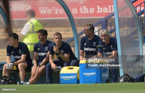 Manuel Pellegrini of West Ham United watches on from the dugout during the pre season friendly between Wycombe Wanderers and West Ham United at Adams...