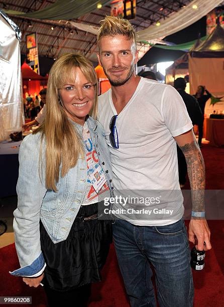 Arts Board Chair, Maria Bell and soccer player, David Beckham attend P.S. Arts Express Yourself 2009 at Barker Hangar at the Santa Monica Airport on...